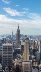 Vertical Skyline of a City with Tall and Thin Buildings Under Cloudy Sky