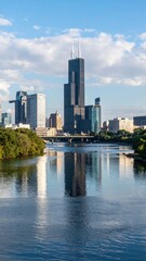 Stunning City Skyline with River Reflecting Architecture and Clouds