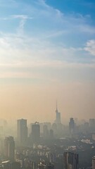 Fototapeta premium City Skyline Shrouded in Thick Smog and Pollution Reducing Visibility