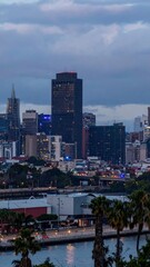 Fototapeta premium Urban City Skyline at Dusk with Emergency Lights Flashing Brightly