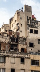 Urban Decay in City Skyline with Crumbling Facades and Broken Windows