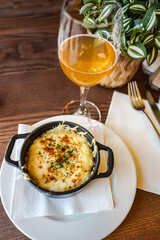 Baked egg with camembert - traditional Normandy dish