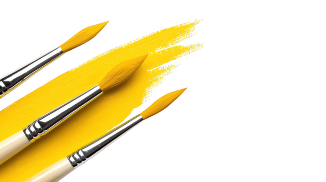 Vibrant yellow paint brushes, a duo ready for artistic expression and home improvement projects