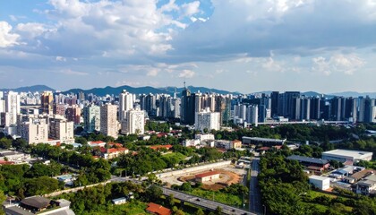 Obraz premium Aerial View of Urban Cityscape Under Dramatic Cloudy Sky