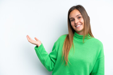 Young caucasian woman isolated on white background extending hands to the side for inviting to come