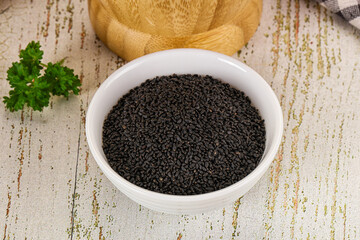 Black dry Nigella seeds in the bowl