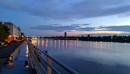 Obraz premium Serene Rooftop View of River with Beautiful Reflections at Dusk
