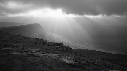 Dramatic Sunbeams Breaking Through Clouds Over High Alpine Landscape