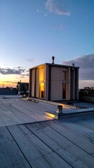 Rooftop Scene Highlighting Natural and Artificial Lighting Contrast