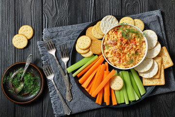 pimento cheese dip served with crackers, veggies
