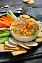 pimento cheese dip served with crackers, veggies