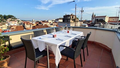Sunny Rooftop Table Setup for Social Gathering with Scenic View