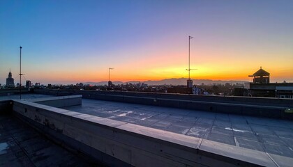 Naklejka premium Rooftop View at Sunrise, Noon, Sunset, and Midnight in Urban Landscape