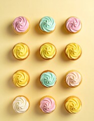 A dozen pastel colored cupcakes arranged in a grid on a yellow background