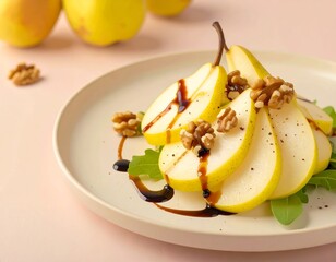 A plate of pear slices drizzled with balsamic glaze topped with walnuts and arugula