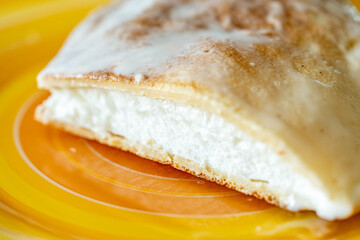 Slice of omelette poulard with pancakes on a light background. close-up
