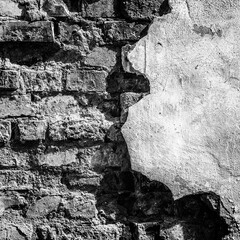 A VERY OLD WALL - Bricks and plaster of an abandoned building
