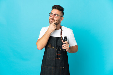 Barber man in an apron having doubts