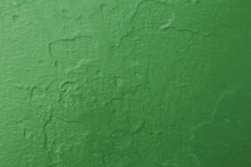Abstract background of green damaged wall.