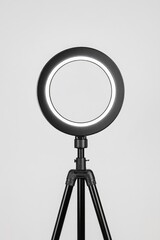 Ring light on tripod.  A simple, adjustable ring light fixture mounted on a sturdy tripod