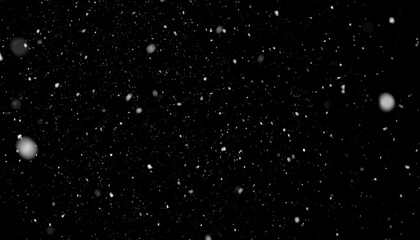 A night sky filled with falling snow particles.