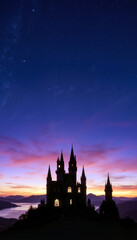 Obraz premium Gothic castle silhouette at sunset with starry sky 