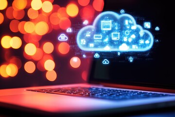 Laptop with glowing cloud computing graphic overlay