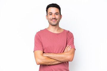 Young handsome man over isolated white background keeping the arms crossed in frontal position