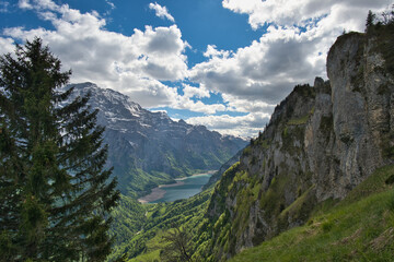 Landscape of the Wiggis mountain with Glarus Alps and Klöntal lake with little water in Switzerland
