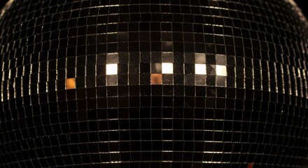 Close-up of a Disco Ball's Reflective Surface, Sparkling Lights Reflecting off Mirrored Tiles