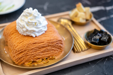 hai tea bingsu served with grass jelly and whipped cream
