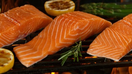 Close-up of Delicious Salmon Fillets on a Grill with Roaring Flames