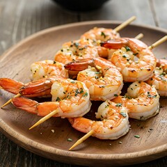 Grilled shrimp skewers with herbs on a wooden plate close up view