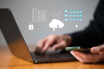 Business man work with laptop seek data input and output from data icon floating on screen.