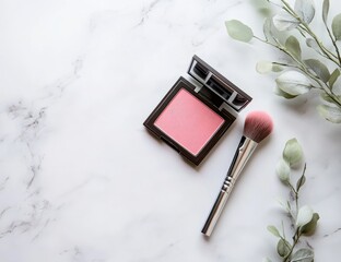 Pink blush compact and brush on marble