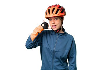 Young cyclist girl over isolated chroma key background making phone gesture. Call me back sign