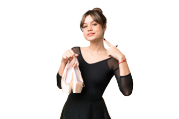 Young girl practicing ballet over isolated chroma key background giving a thumbs up gesture