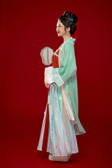Fototapeta premium Girl wearing Hanfu from the Northern and Southern Song Dynasty on a red background