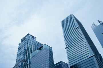 office buildings reflective skyscrapers, business transparent glass wall of office.