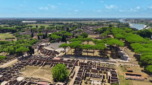 Aerial view on the Roman theatre of Ostia Antica, a large archaeological site, close to the modern town of Ostia. High quality footage in 4k format