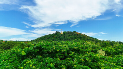 Obraz premium Buriram's Pride. Phra Suphattharabophit and the Stunning Landscape of Khao Kradong, buddha statue in thailand.