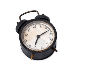 An old abandoned Black alarm clock analog classic vintage style is rusty and dirty isolated on...