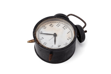 An old abandoned Black alarm clock analog classic vintage style is rusty and dirty isolated on...