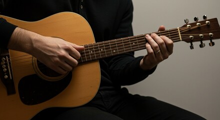 Fototapeta premium Acoustic Guitarist: A Moody Close-Up