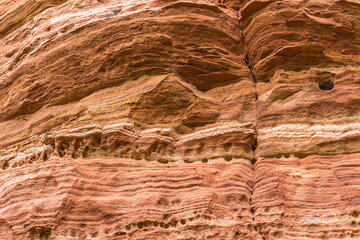 Red rock formations a close-up of the bizarre structure in reserve Altschlossfelsen in the Saarland region of Germany the stones have a bright red and orange color and abstract form