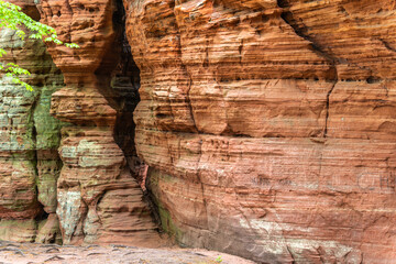 Red rock formations reserve Altschlossfelsen in the Saarland region of Germany the stones have a bright red and orange color and abstract form