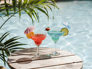 Colorful Tropical Cocktails Served by the Poolside in a Relaxing Setting