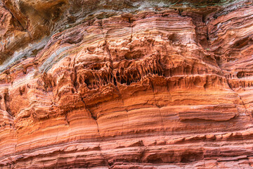 Red rock formations a close-up of the bizarre structure in reserve Altschlossfelsen in the Saarland region of Germany the stones have a bright red and orange color and abstract form