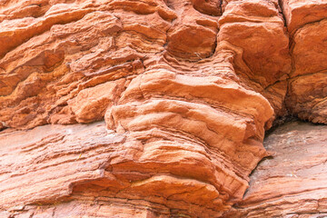 Red rock formations a close-up of the bizarre structure in reserve Altschlossfelsen in the Saarland region of Germany the stones have a bright red and orange color and abstract form