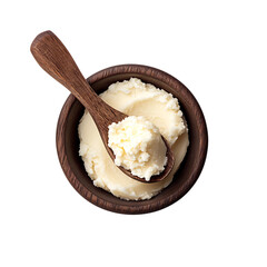 Shea butter in wooden bowl with wooden spoon